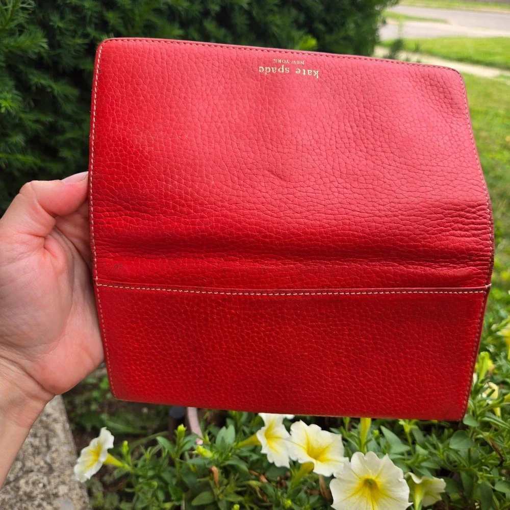 kate spade bifold pebble leather wallet. In red. Flaws